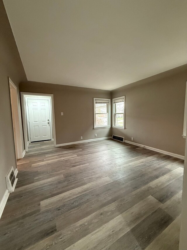 18655 Strasburg St, Detroit, MI 48205 - empty room with visible vents, baseboards, and wood finished floors