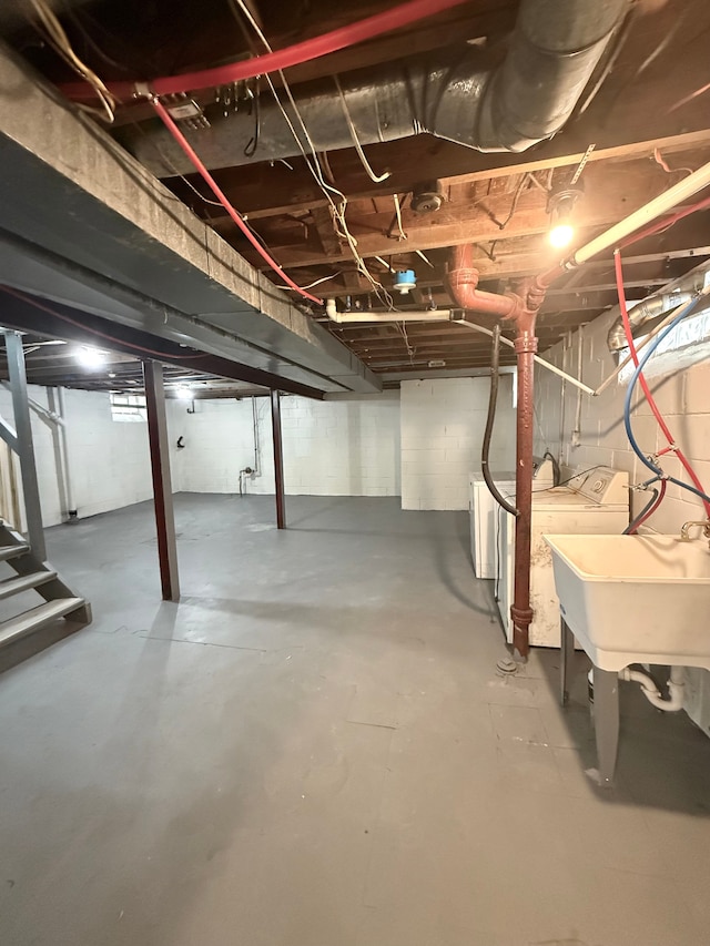 18655 Strasburg St, Detroit, MI 48205 - unfinished basement featuring separate washer and dryer, a sink, and stairs