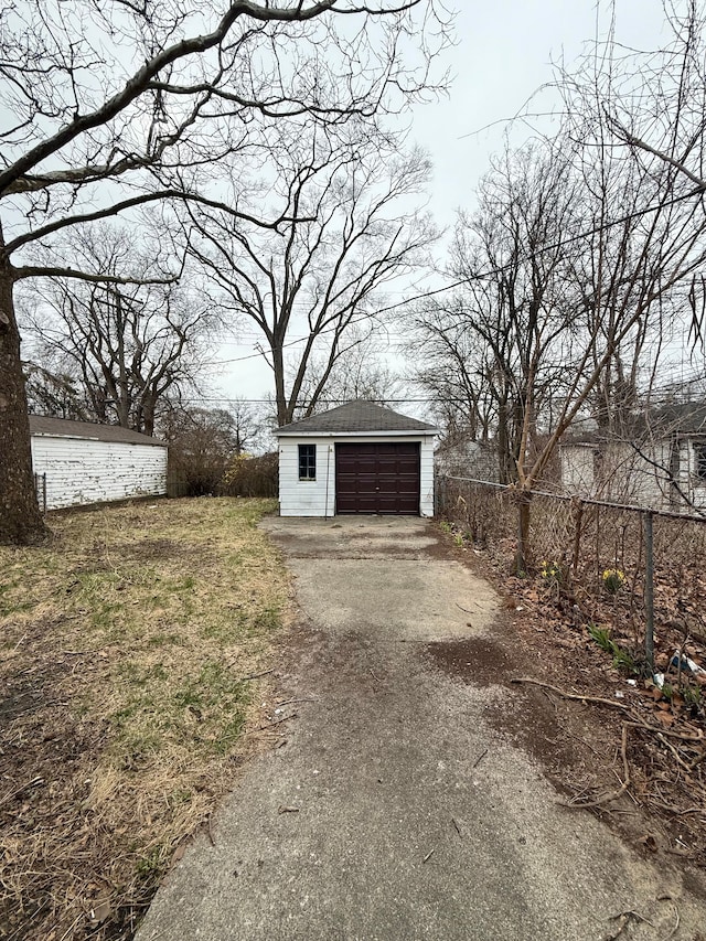 18655 Strasburg St, Detroit, MI 48205 - detached garage featuring aphalt driveway and fence