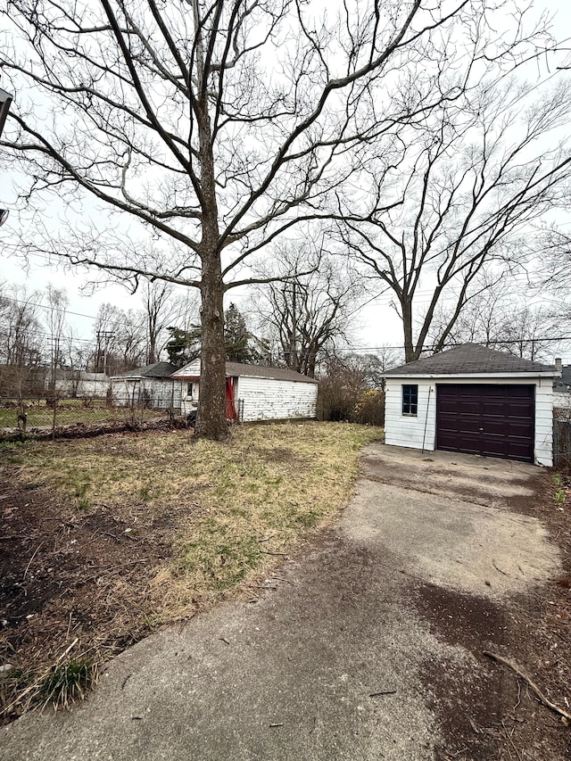18655 Strasburg St, Detroit, MI 48205 - view of yard featuring an outbuilding and a detached garage