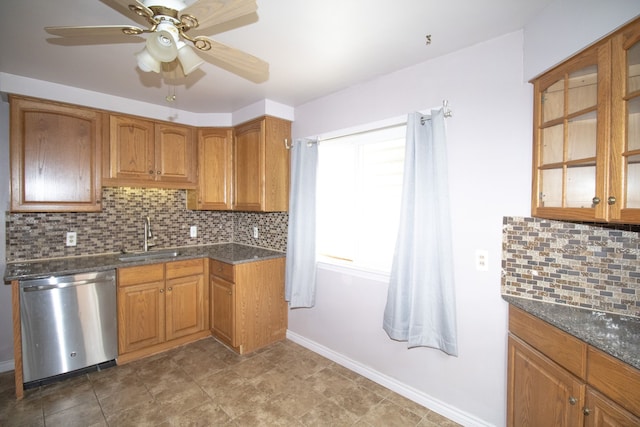 kitchen with a sink, a ceiling fan, brown cabinets, stainless steel dishwasher, and decorative backsplash