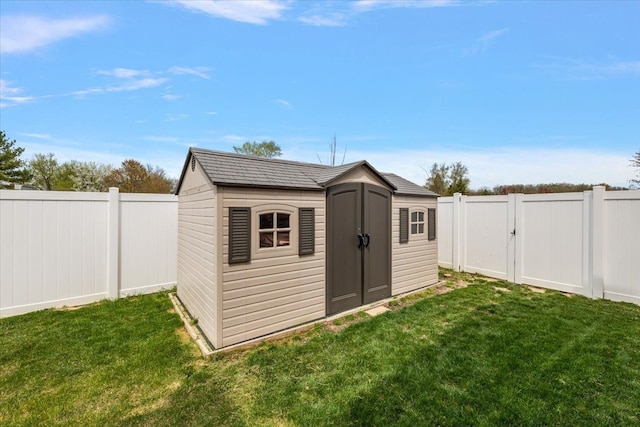 view of shed featuring a fenced backyard