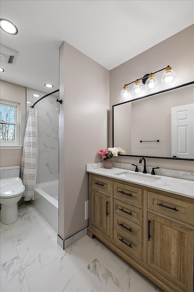 full bathroom featuring toilet, marble finish floor, shower / tub combo, and vanity