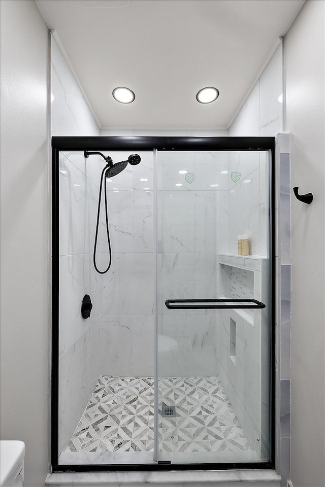 full bath with recessed lighting, a stall shower, and toilet