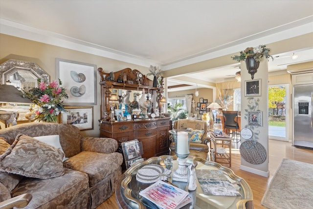 dining area featuring a ceiling fan and light wood-style floors