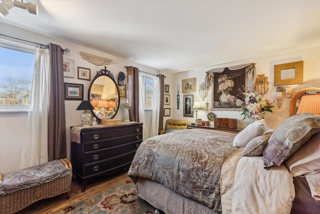 bedroom with wood finished floors