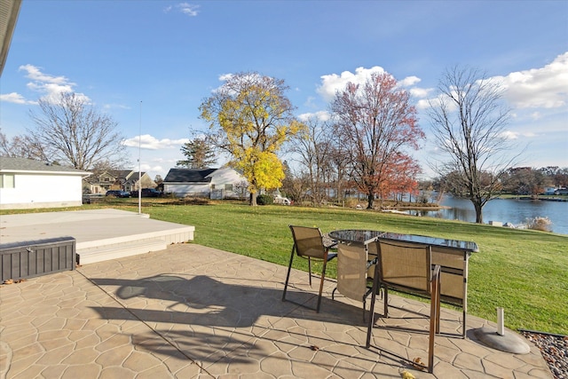 view of patio / terrace with a water view and outdoor dining space