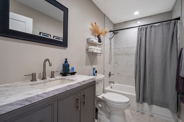 full bath with toilet, shower / bath combo, and vanity