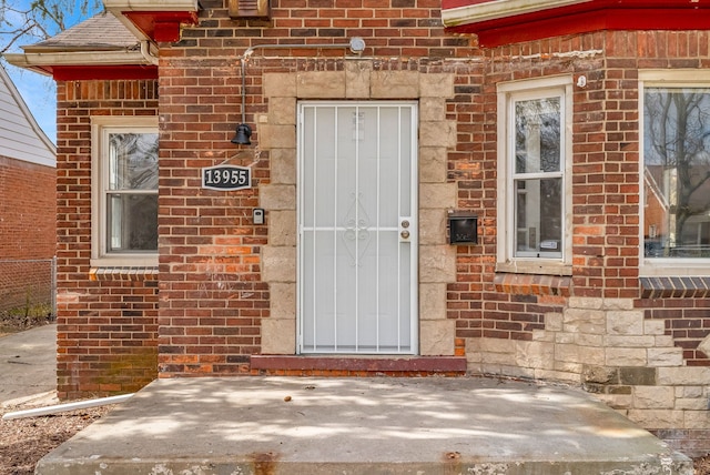13955 Prevost St, Detroit, MI 48227 - entrance to property featuring roof with shingles and brick siding