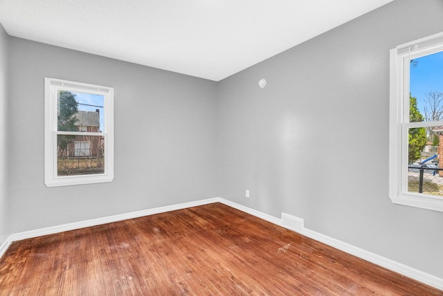 13955 Prevost St, Detroit, MI 48227 - unfurnished room with visible vents, baseboards, and wood finished floors