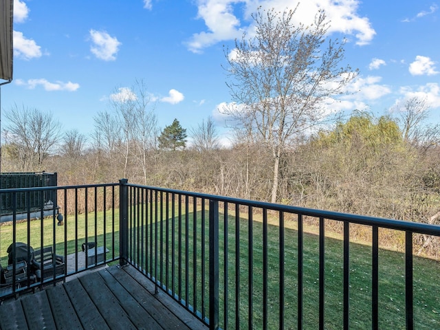 wooden deck with a yard