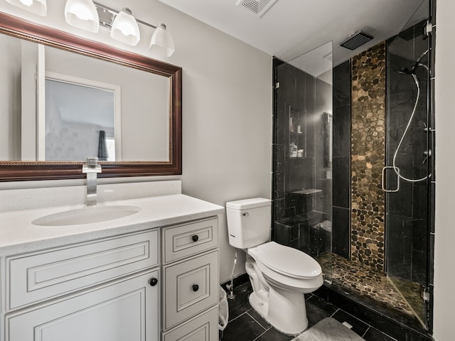 full bath featuring vanity, a stall shower, toilet, and visible vents