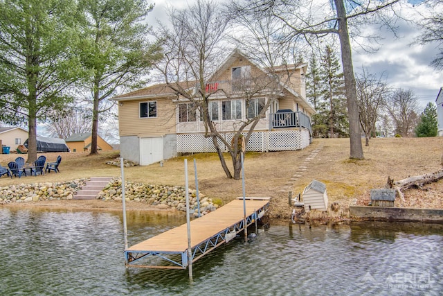 view of dock with a deck with water view
