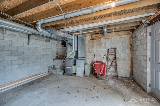 unfinished below grade area featuring concrete block wall