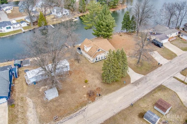 bird's eye view featuring a residential view and a water view