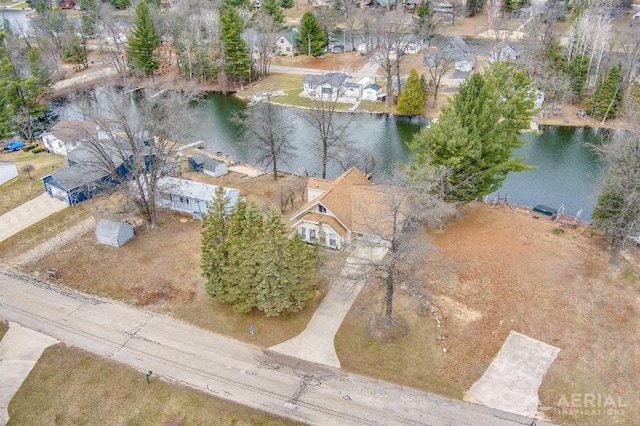 birds eye view of property featuring a residential view and a water view