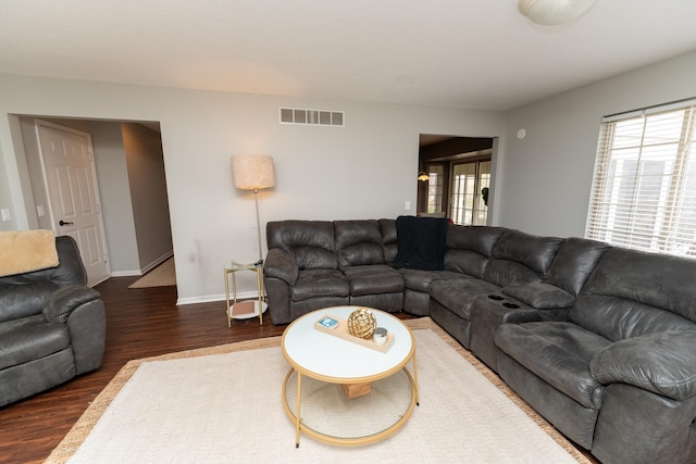 1527 Somerset Ct, Mount Pleasant, MI 48858 - living room with wood finished floors, baseboards, and visible vents