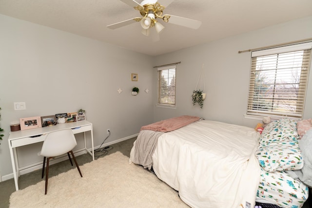 1527 Somerset Ct, Mount Pleasant, MI 48858 - bedroom featuring ceiling fan, light colored carpet, baseboards, and multiple windows