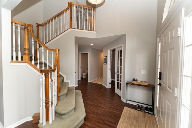 1527 Somerset Ct, Mount Pleasant, MI 48858 - entryway with baseboards, a high ceiling, recessed lighting, wood finished floors, and stairs