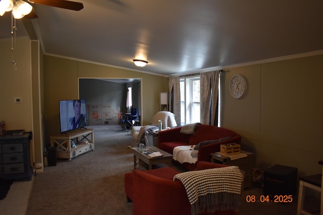 carpeted living room featuring crown molding, a ceiling fan, and vaulted ceiling