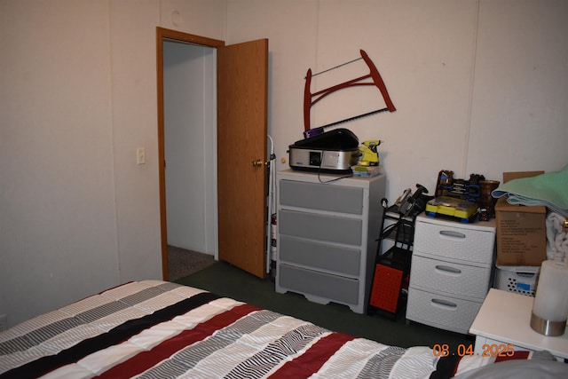 bedroom with dark colored carpet