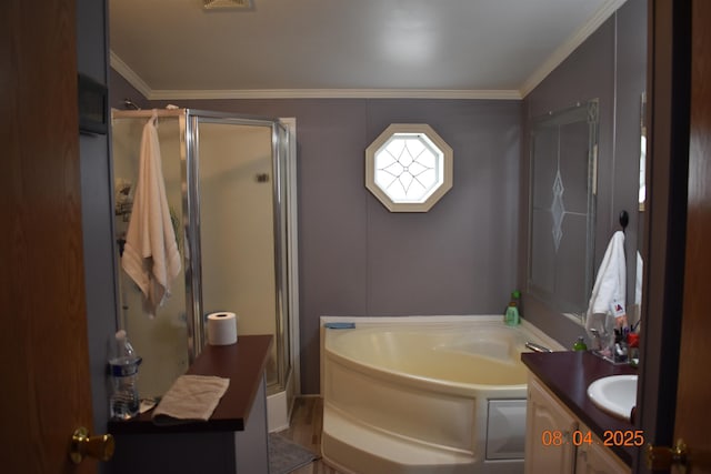 bathroom with a bath, a stall shower, vanity, and crown molding