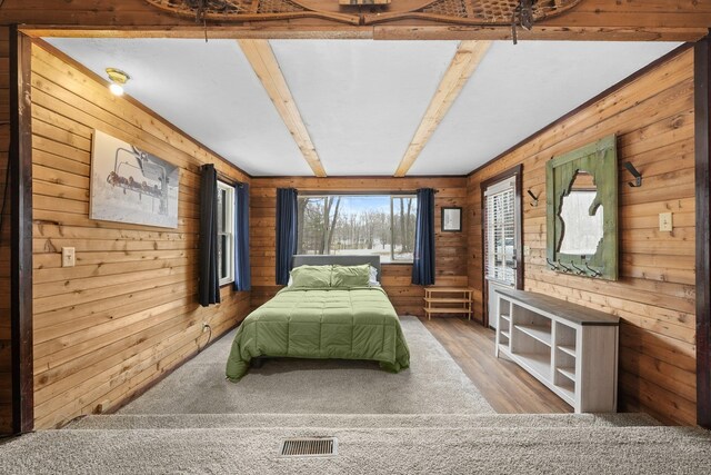 9341 W M-115, Mesick, MI 49668 - bedroom featuring wood finished floors, wood walls, and visible vents
