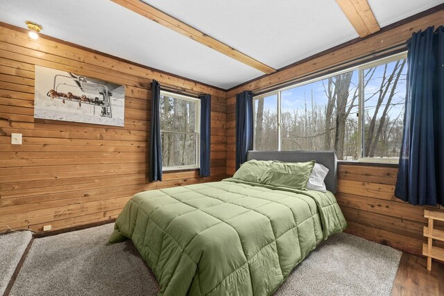 9341 W M-115, Mesick, MI 49668 - bedroom with wood walls, beam ceiling, and wood finished floors