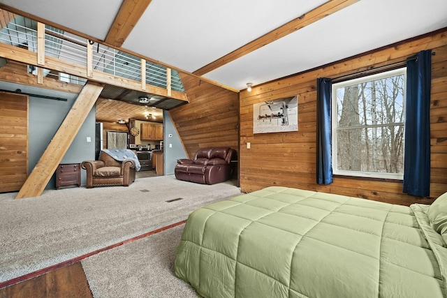 9341 W M-115, Mesick, MI 49668 - bedroom with wood walls, a barn door, and vaulted ceiling with beams