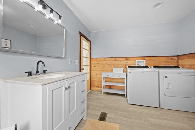 9341 W M-115, Mesick, MI 49668 - laundry room with a sink, washing machine and dryer, and wooden walls