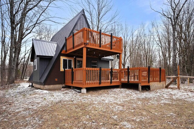 9341 W M-115, Mesick, MI 49668 - back of house featuring a deck and metal roof