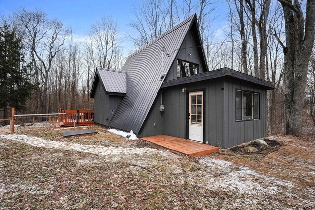 9341 W M-115, Mesick, MI 49668 - back of house with a deck and metal roof