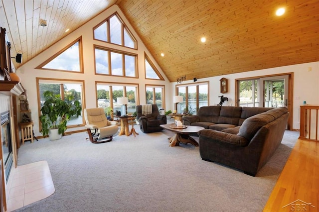 living area with a fireplace with flush hearth, high vaulted ceiling, carpet, and wooden ceiling