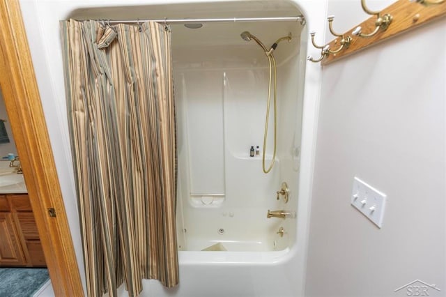 full bath with shower / bath combo with shower curtain and vanity