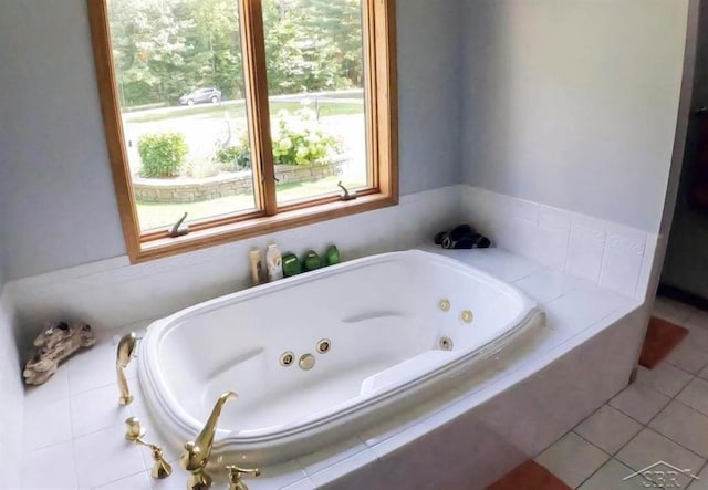 bathroom featuring a jetted tub and tile patterned floors