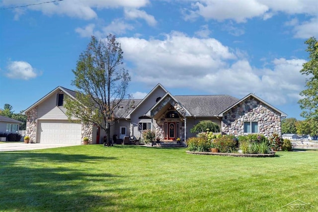 view of front facade featuring driveway, a front lawn, and stone siding