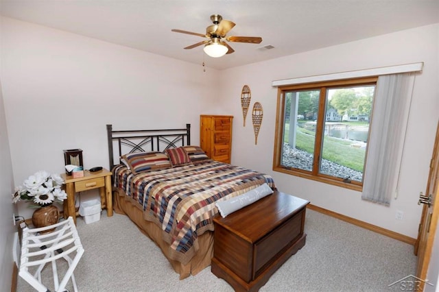 bedroom with carpet flooring, baseboards, visible vents, and ceiling fan