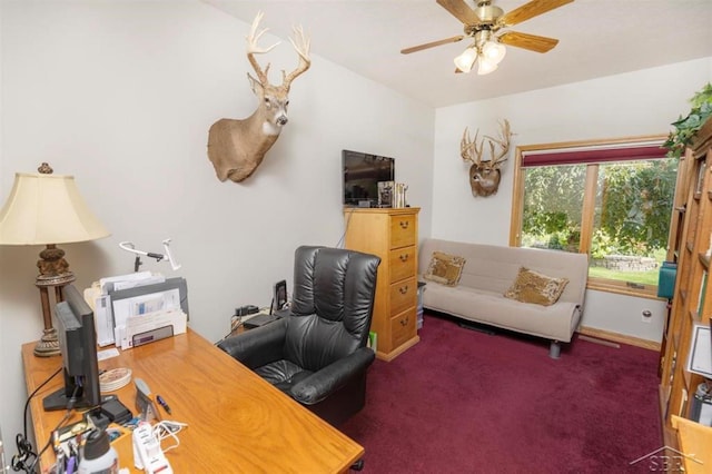 office area with a ceiling fan and carpet flooring