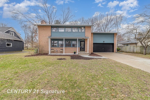 1804 Ardmore St, Midland, MI 48642 - view of front of home with concrete driveway, brick siding, an attached garage, and a chimney
