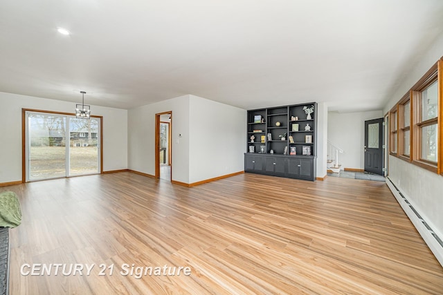 1804 Ardmore St, Midland, MI 48642 - unfurnished living room with baseboard heating, a chandelier, baseboards, and light wood-style floors