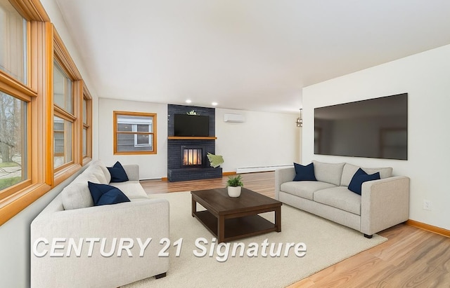 1804 Ardmore St, Midland, MI 48642 - living room with wood finished floors, baseboard heating, baseboards, a brick fireplace, and recessed lighting
