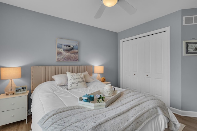 442 Constitution Ave, Brooklyn, MI 49230 - bedroom featuring wood finished floors, a closet, baseboards, and a ceiling fan