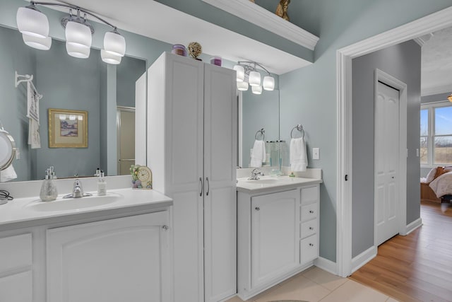 442 Constitution Ave, Brooklyn, MI 49230 - bathroom with vanity, ensuite bathroom, baseboards, and tile patterned floors