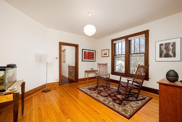 300 3rd St, Ann Arbor, MI 48103 - living area featuring baseboards and light wood finished floors