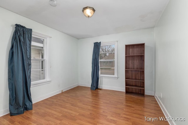 1193 E Apple Ave, Muskegon, MI 49442 - empty room featuring light wood-style flooring and baseboards