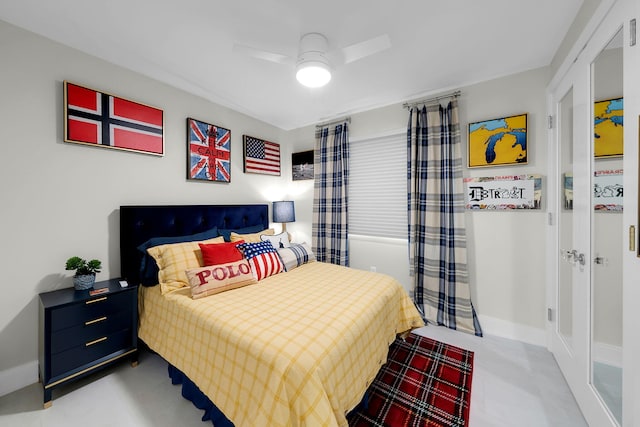 bedroom with ceiling fan and baseboards