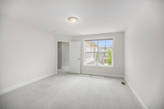 3092 N Spurway Dr, Ann Arbor, MI 48105 - unfurnished room featuring light carpet and baseboards