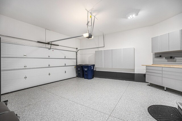 3092 N Spurway Dr, Ann Arbor, MI 48105 - garage featuring a garage door opener