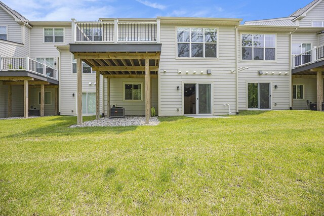 3092 N Spurway Dr, Ann Arbor, MI 48105 - rear view of property with central AC, a yard, and a wooden deck