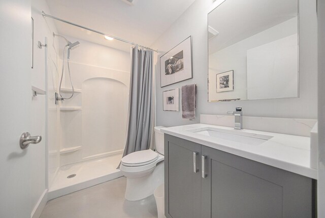 3092 N Spurway Dr, Ann Arbor, MI 48105 - bathroom with vanity, a shower with shower curtain, and toilet